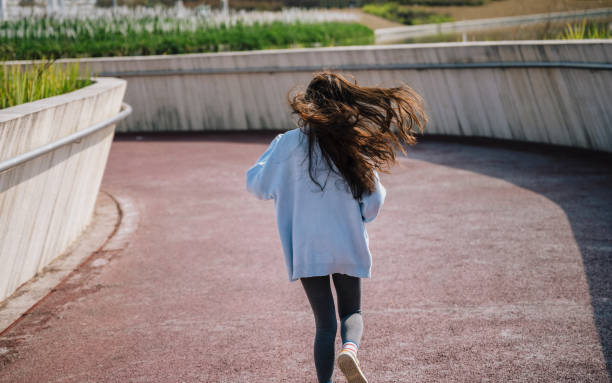 istock Young Asian women running on sunny days 1372759023