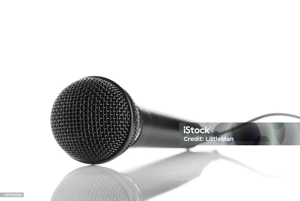 Microphone an isolated microphone with reflection. Audio Electronics Stock Photo