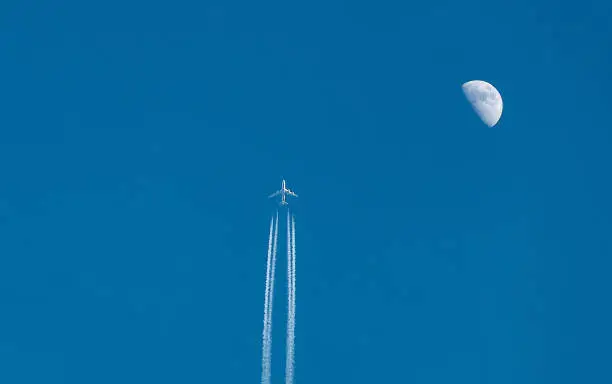 Photo of moon and plane