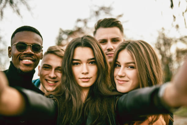 istock Cute Selfie By Multiethnic Friends In Park 1372763405