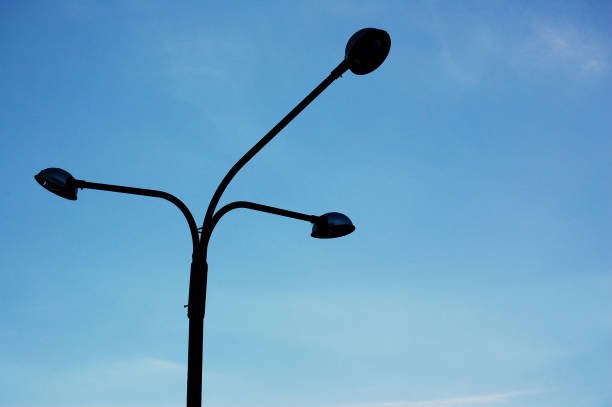 istock Unlit lamppost with clear blue sky in the background without clouds. 1372764541