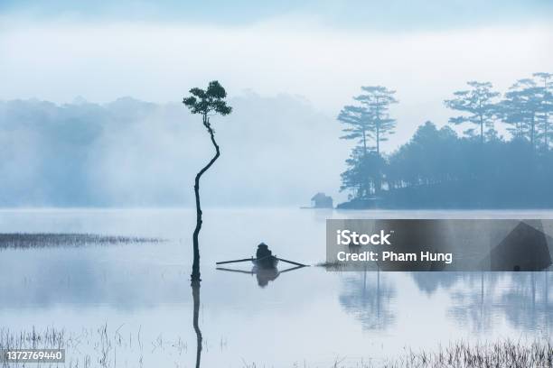 Fisherman In Tuyen Lam Lake Stock Photo - Download Image Now - Vietnam, Art, Fisher - Role