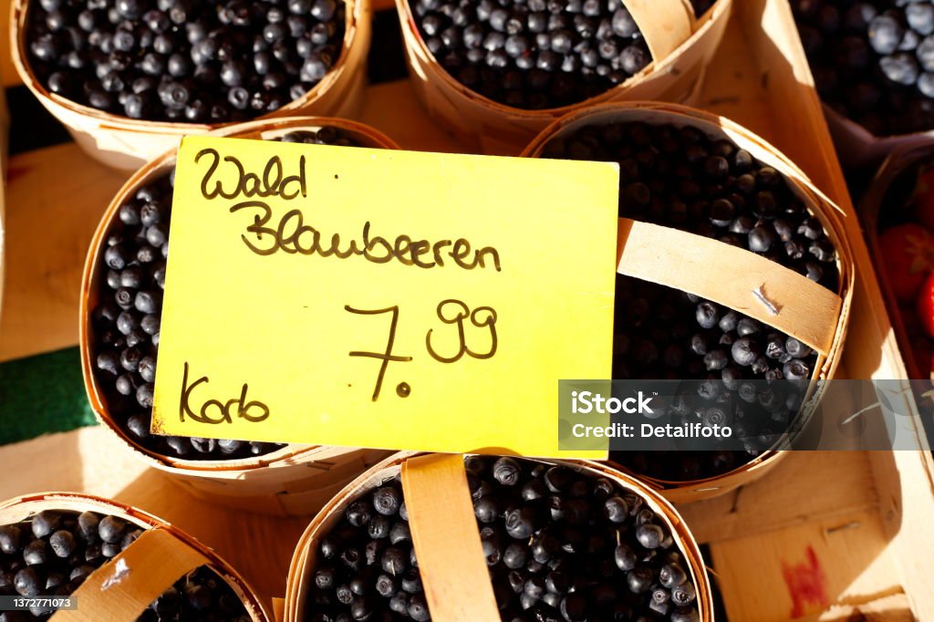 Fresh forest blueberries in baskets at a market stall, Germany Color Image Stock Photo