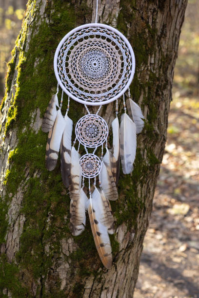 istock Handmade dream catcher with feathers threads and beads rope hanging 1372776063