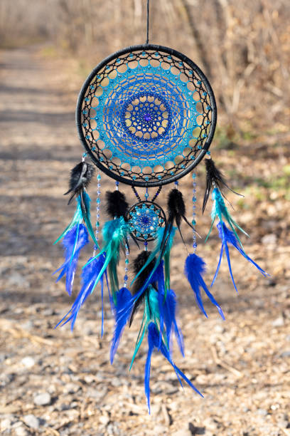 istock Handmade dream catcher with feathers threads and beads rope hanging 1372776069