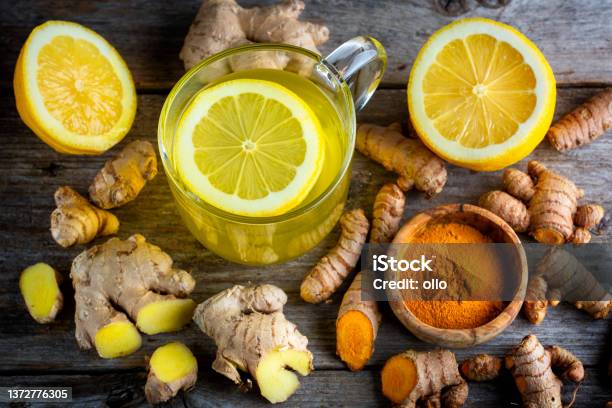 Curcuma Longa Turmeric And Ginger Powder Rhizomes And Tea Stock Photo - Download Image Now