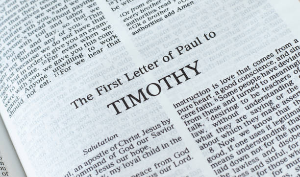 istock Timothy first letter open Holy Bible Book close-up 1372776582