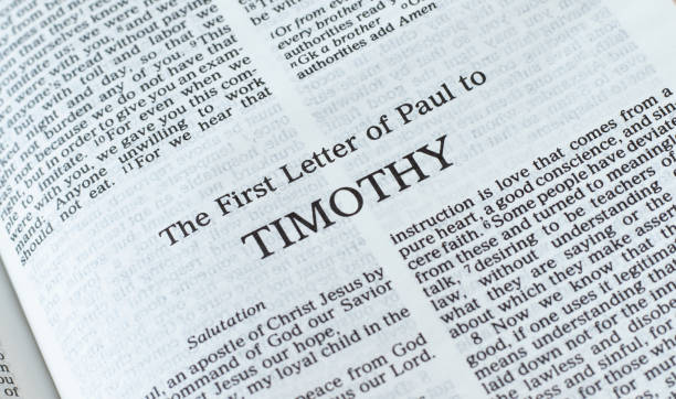 Timothy first letter open Holy Bible Book close-up stock photo