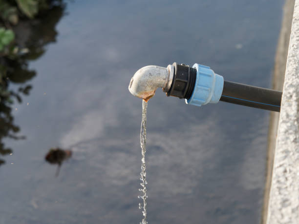 istock Water flowing out from steel pipes 1372778124