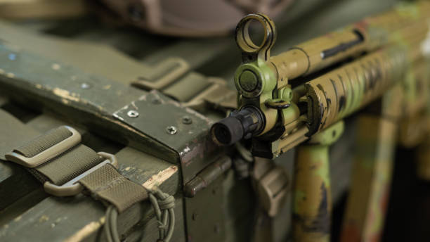 istock mp5 automatic rifle next to ammunition box and other military accessories 1372779867