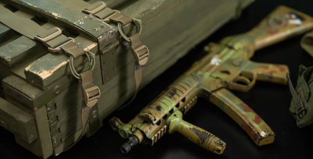 istock mp5 automatic rifle next to ammunition box and other military accessories 1372779870