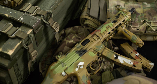 istock mp5 automatic rifle next to ammunition box and other military accessories 1372779872