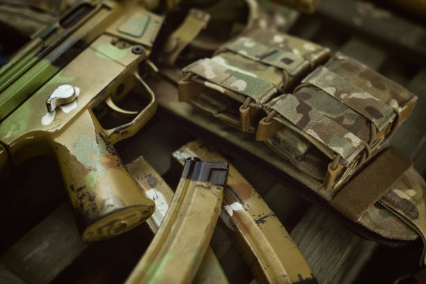 istock mp5 automatic rifle next to ammunition box and other military accessories 1372779883
