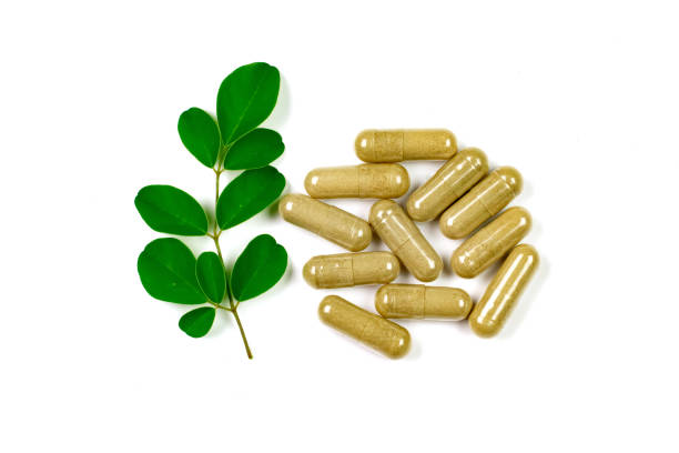 istock Moringa oleifera capsule with moringa leaf isolated on white background. 1372780969