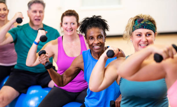 istock Senior African-American woman taking exercise class 1372781457
