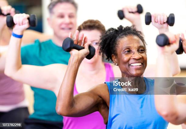 Senior Africanamerican Woman In Exercise Class Stock Photo - Download Image Now - Exercising, Senior Adult, Gym