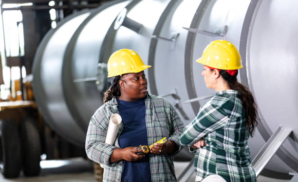 istock Two women working in metal fabrication plant 1372783049