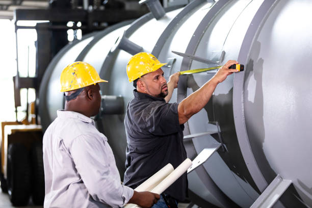 istock Two multiracial men working in metal fabrication plant 1372783251