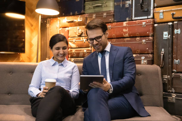istock Multiracial colleagues have fun use tablet sit in office 1372787640