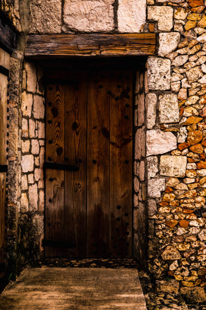 old wooden door in the wall of the building