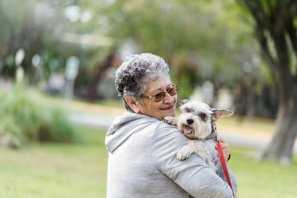 istock Happy granny loving her dog 1372791080