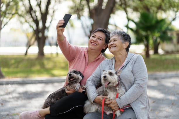 istock Mother and daughter outdoors taking a selfie together 1372791136