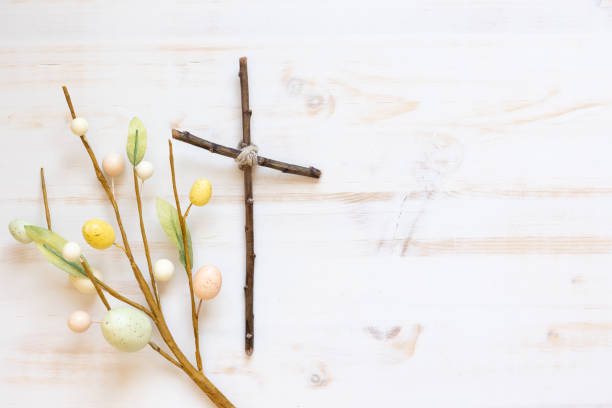 istock Christian cross and Easter decoration on white 1372791531