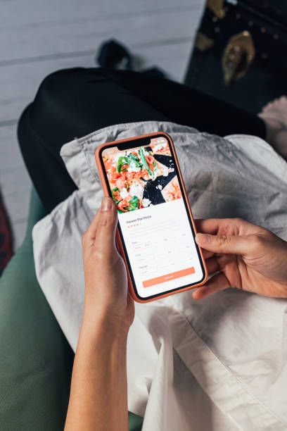istock An Anonymous Woman Ordering Food Online During Quarantine Using Her Smartphone 1372799334
