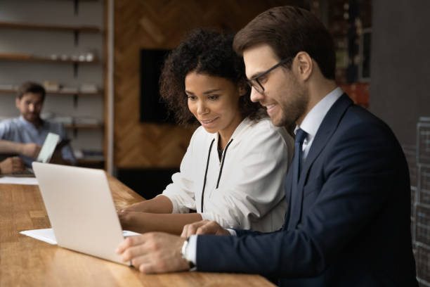 istock Happy young business people working on computer. 1372801526