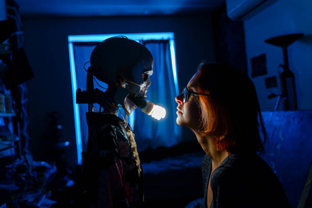istock Young extreme designer is looking at a skeleton turned into a floor lamp in a dark loom 1372801576