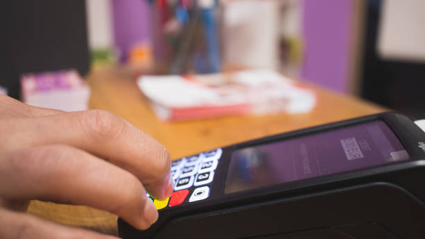 istock young person preparing payment at his card payment terminal 1372801620