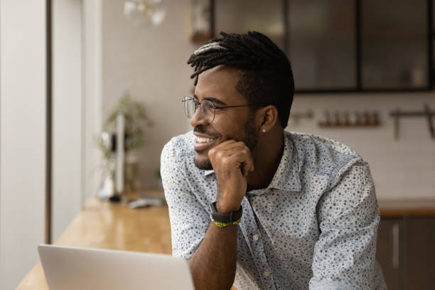 istock Smiling young multiracial businessman looking in distance. 1372801816