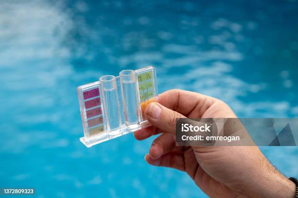 Measuring The Ph Levels In A Pool Stock Photo - Download Image Now - Swimming Pool, Chlorine, pH value
