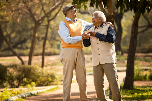 istock Senior male friends having fun at park 1372809428