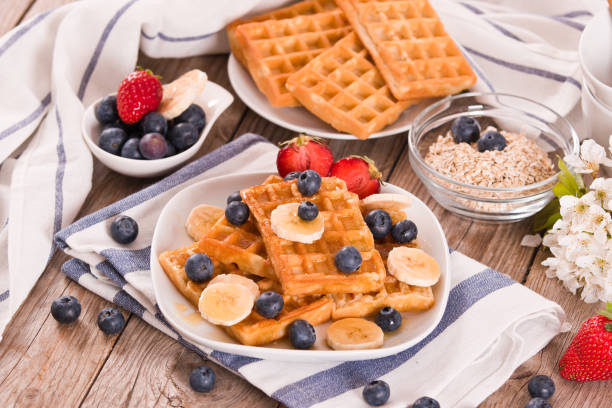 istock Waffles with blueberries, bananas and honey. 1372809642