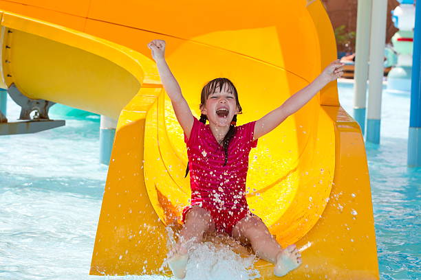 istock Happy girl on waterslide 137280994