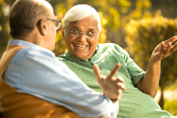 istock Two senior men discussing at park 1372810272