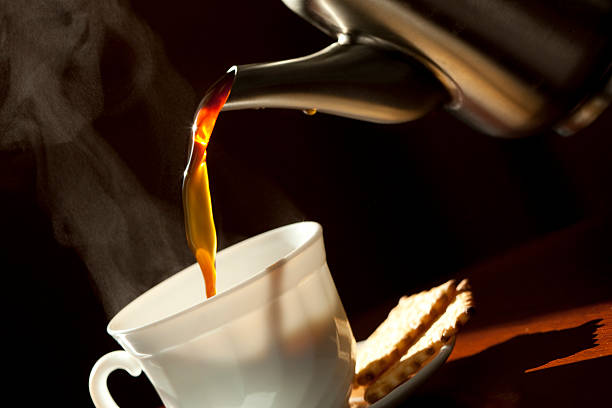 istock Pouring coffee into the white cup . Close-up. 137281035