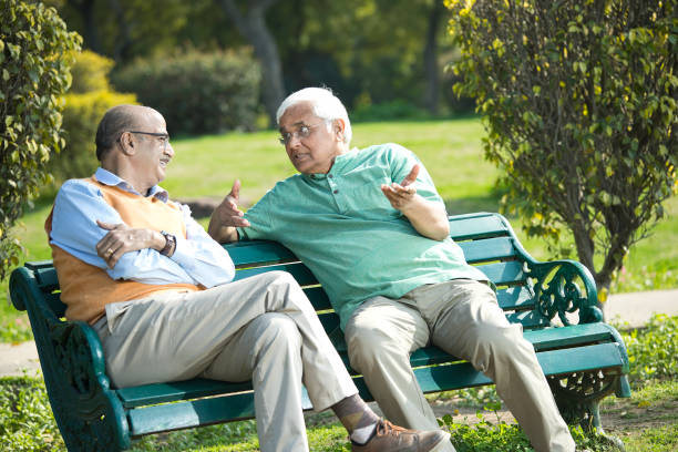 istock Two senior men discussing at park 1372810353