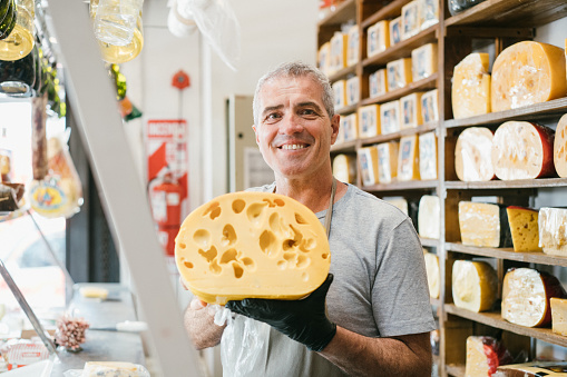 Cheesemonger portrait behind the counter