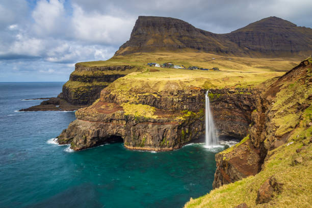 istock View of Mulafossur Waterfall, Faroe Islands. 1372811726
