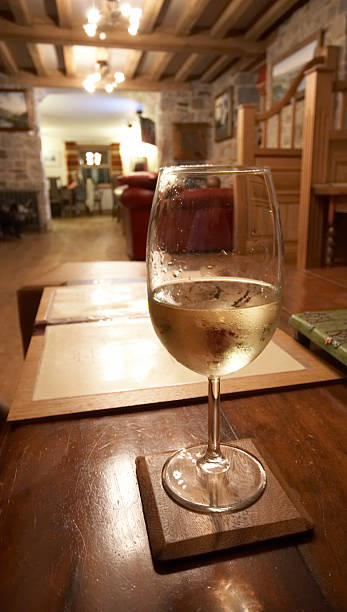 istock Glass of white wine in restaurant setting 137281479