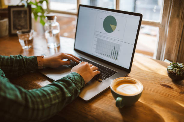 istock Female working on a laptop and drinking coffee. 1372814953