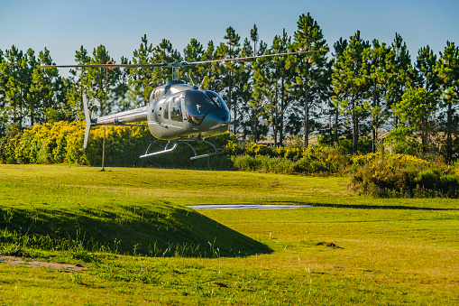 Helicopter landing at countryside landscape, maldonado, uruguay