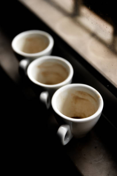 used coffee cups on a windowsill. Winter tones.
