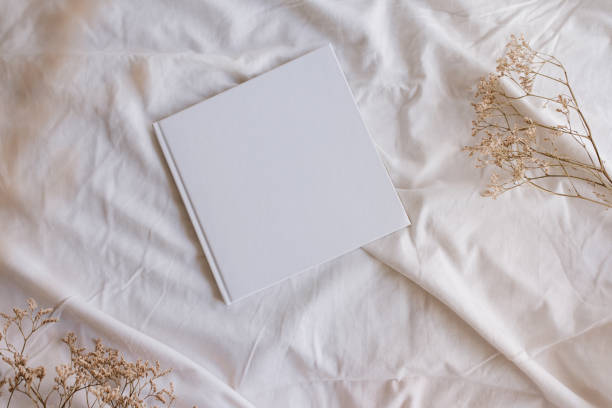 istock White book mockup with some dry sheets on the bed. 1372822172