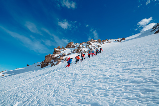 Climbers are walking to the summit of the high altitude mountains in winter season in Turkey ,recorded during a climbing expedition.