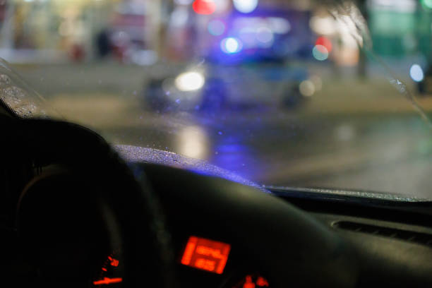 istock blurry steering wheel and car dashboard with blurred night street background 1372825169