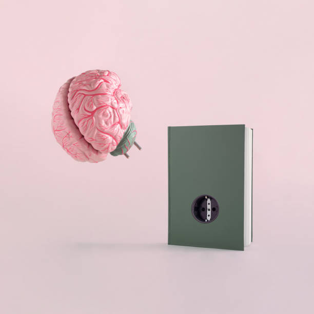 istock Minimal abstract scene with brain and dark green book with socket, on isolated pastel pink-beige background with copy space. Concept of school, reading or education. The idea of book as brain charger. 1372828721
