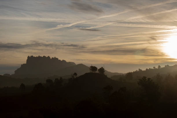 istock Montserrat mountain silhouette in sunrise 1372829754